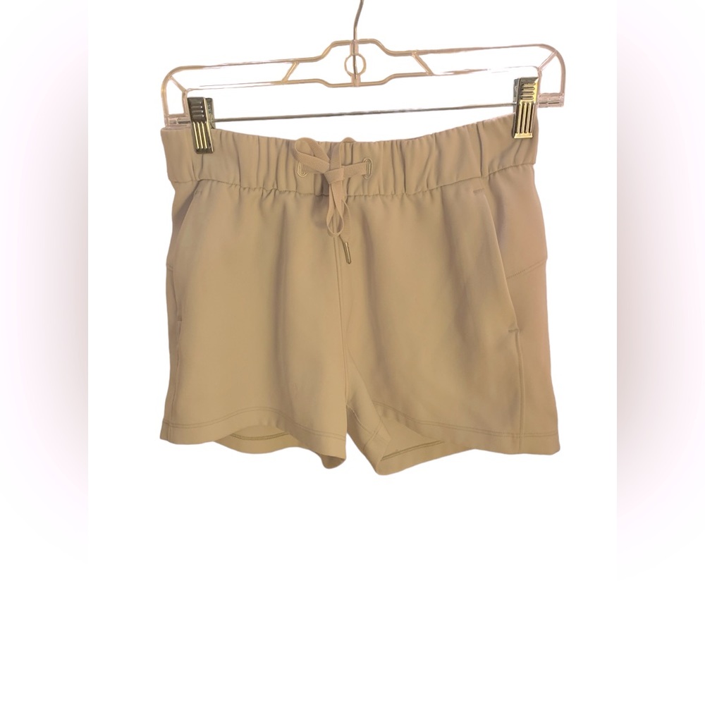 Lululemon athletic shorts, handy pockets and flattering cut &back yolk, Size 4
